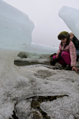 Along the river, the ice clung high to the bank and created small caves. They were just big enough for child-sized explorers. 